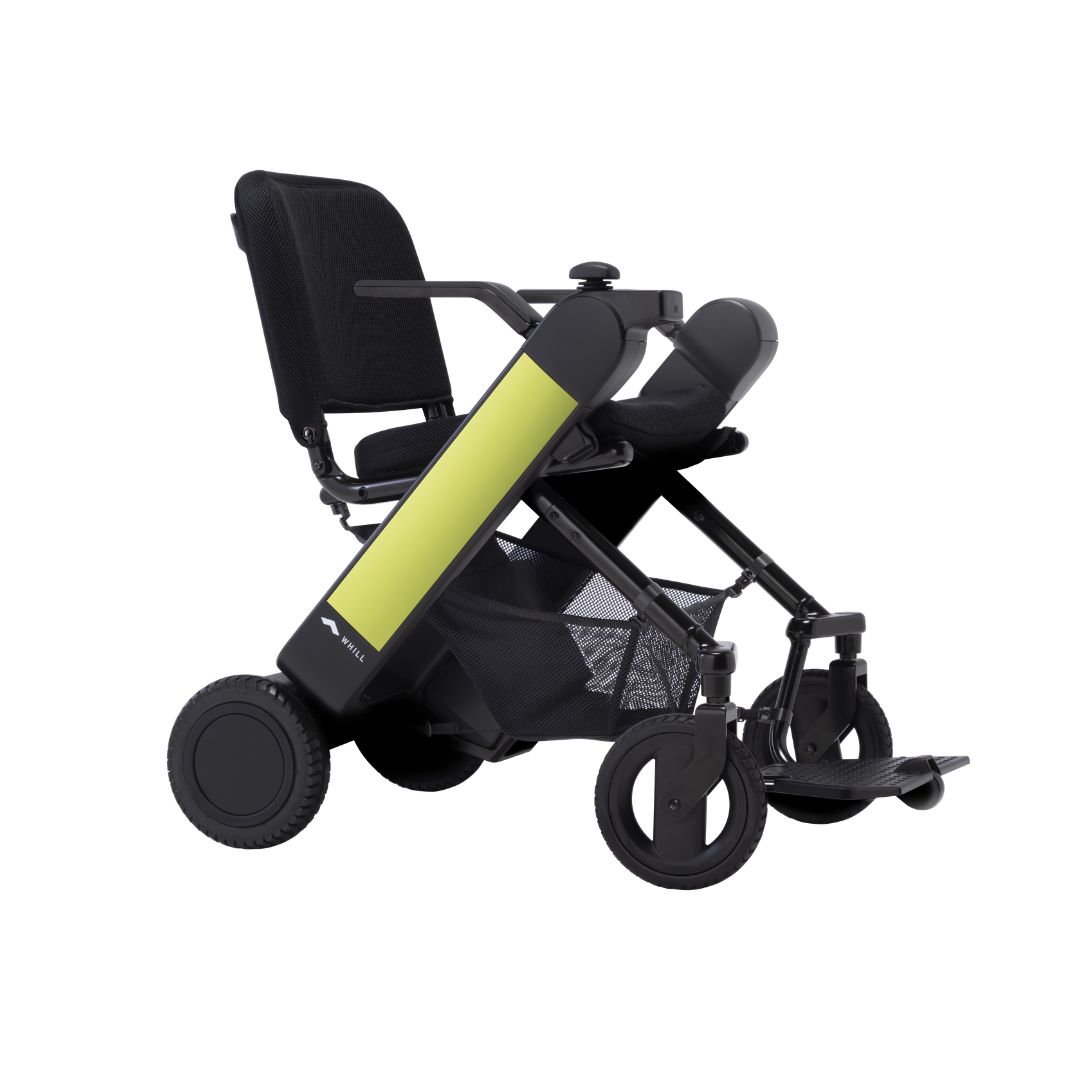 The Whill Model F Lightweight Portable Electric Wheelchair is shown from a side angle on a white background, featuring a mesh storage basket, black seat and frame, and yellow side panels. Specifications and warranty details available on request.